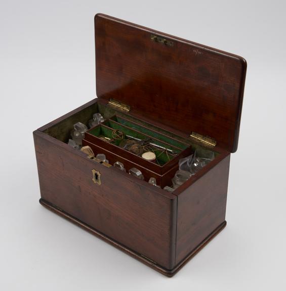 Medicine chest, hinged lid, tray-style drawers, with 20 bottles