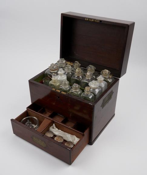 Rectangular mahogany medicine chest with 25 glass bottles