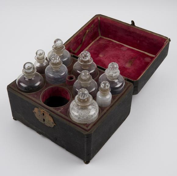 Wooden medicine chest covered with black shagreen and lined