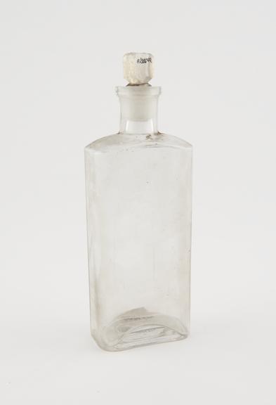 Clear glass medicine bottle, one of 32, from Savory and Moore