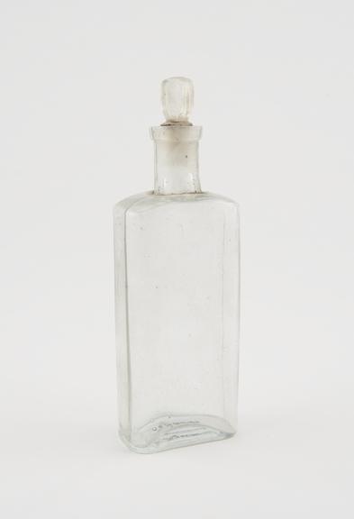 Clear glass medicine bottle, one of 32, from Savory and Moore