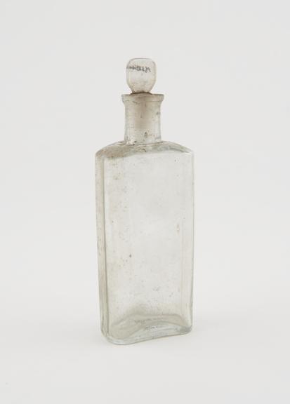 Clear glass medicine bottle, one of 32, from Savory and Moore