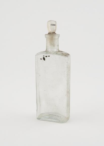 Clear glass medicine bottle, one of 32, from Savory and Moore