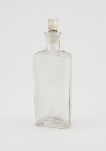 Clear glass medicine bottle, one of 32, from Savory and Moore
