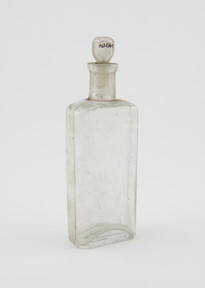 Clear glass medicine bottle, one of 32, from Savory and Moore