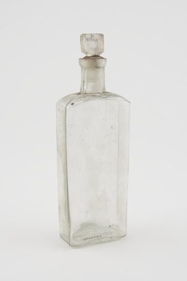 Clear glass medicine bottle, one of 32, from Savory and Moore