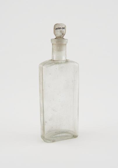 Clear glass medicine bottle, one of 32, from Savory and Moore