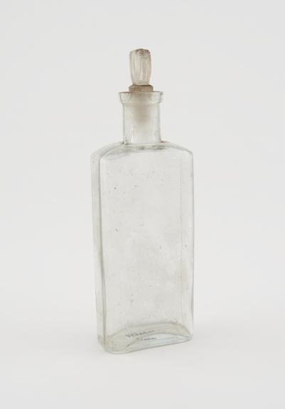 Clear glass medicine bottle, one of 32, from Savory and Moore