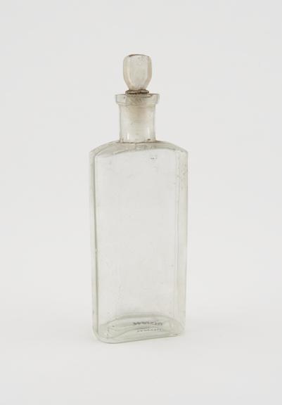 Clear glass medicine bottle, one of 32, from Savory and Moore