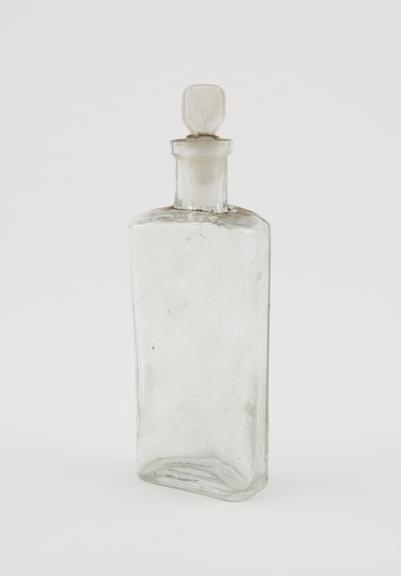Clear glass medicine bottle, one of 32, from Savory and Moore