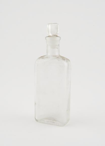 Clear glass medicine bottle, one of 32, from Savory and Moore