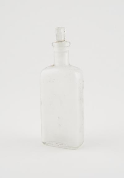 Clear glass medicine bottle, one of 32, from Savory and Moore