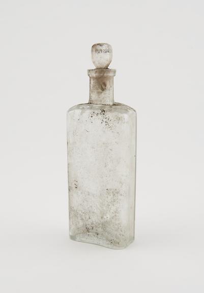 Clear glass medicine bottle, one of 32, from Savory and Moore