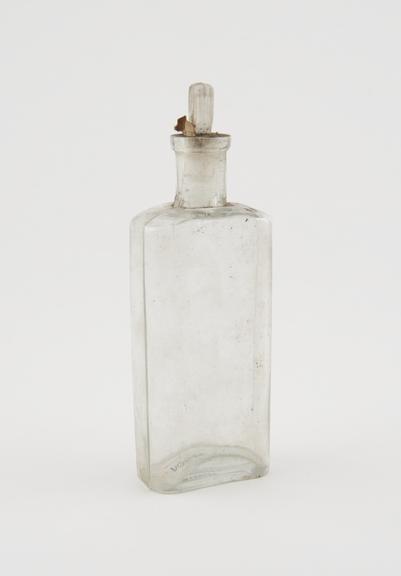 Clear glass medicine bottle, one of 32, from Savory and Moore