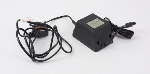 Battery charger for portable mobile telephone with large battery pack, 1980-1991