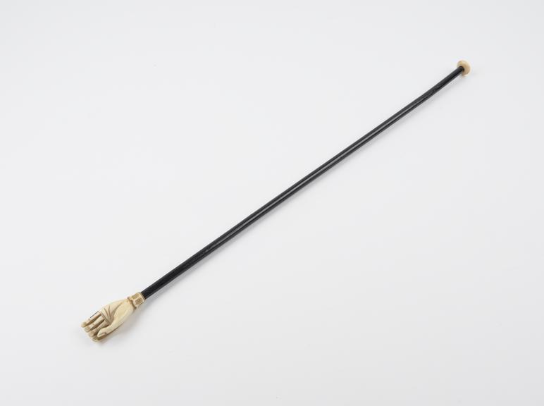 Ivory and horn back scratcher