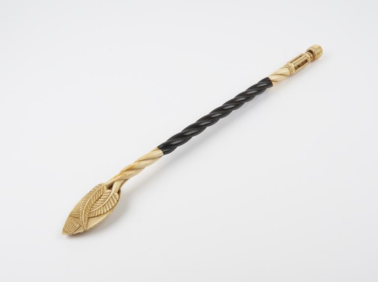 Ebony and ivory back scratcher, wooden twisted stem