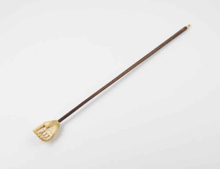 Back scratcher with wooden rod