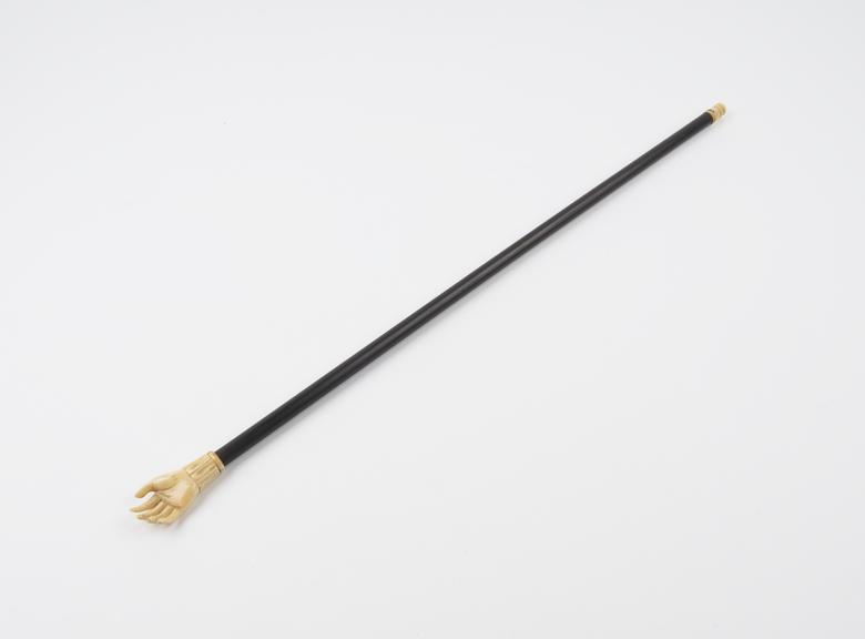 Ivory and wood back scratcher