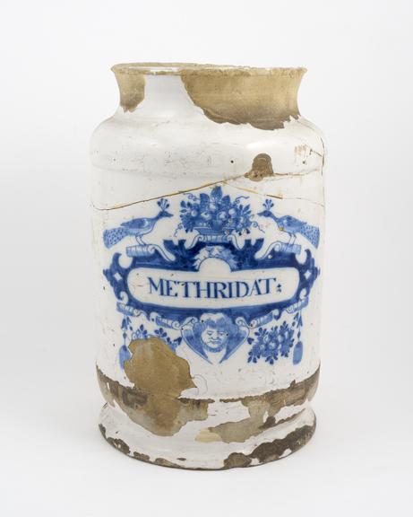 Large tin glazed earthenware drug jar, peacock motif