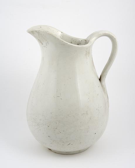 Mid C20 white-glazed English jug from the pharmacy department