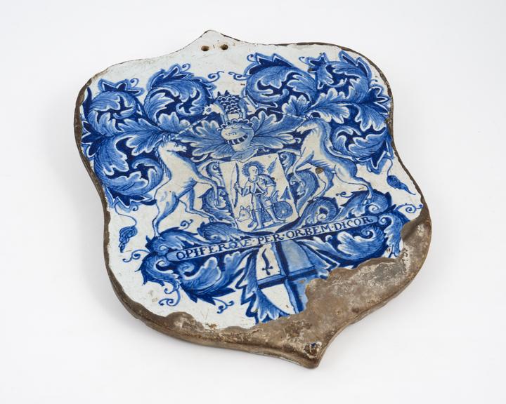 Earthenware pill tile, tin-glazed, shield shaped