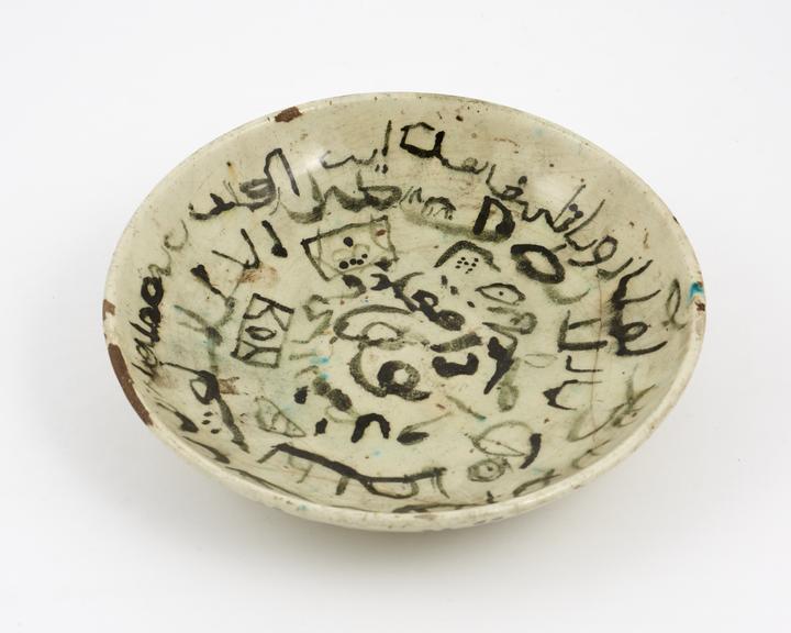 Pottery bowl with crude spiralling inscription on inside