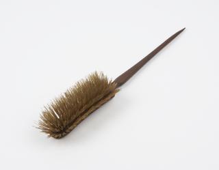 Wooden brush with short head and long handle tapering to point