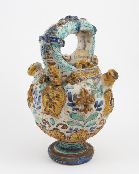 Syrup jar, earthenware with ornate polychrome applique