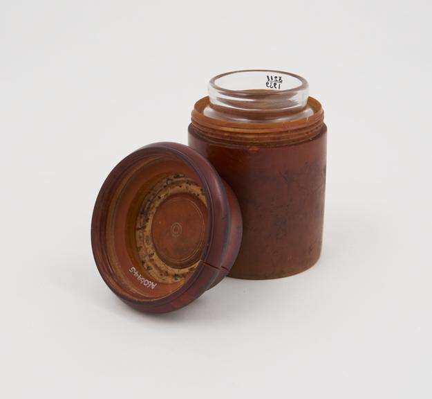 Bottle in boxwood case, by Low Son and Benbow