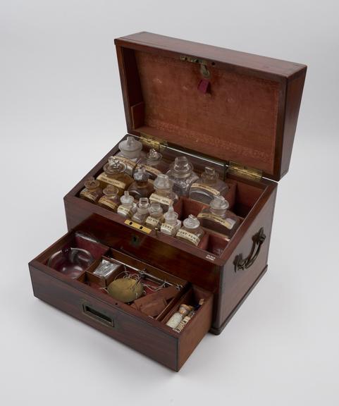 Rectangular mahogany medicine chest, with 18 glass bottles