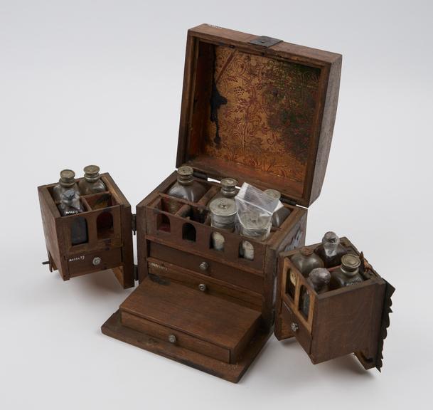 Small walnut(?) medicine chest with 2 hinged front sections and