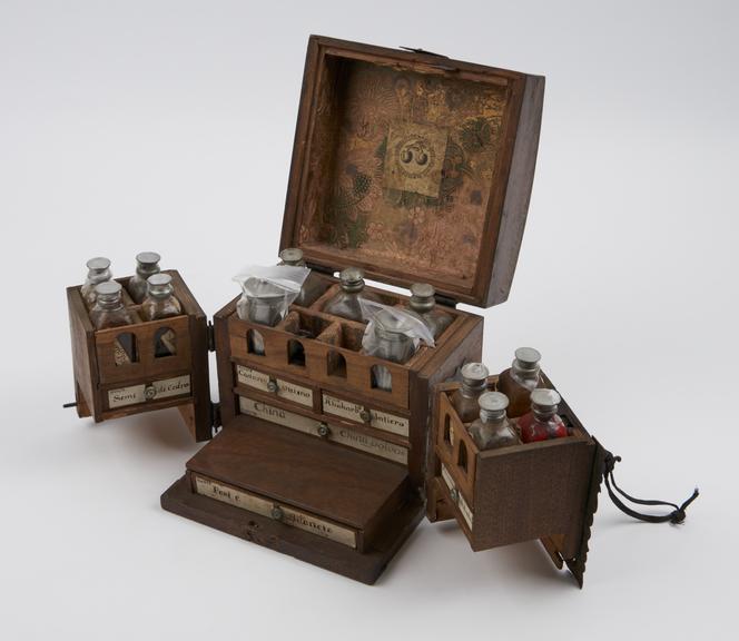 Small walnut medicine chest with 2 hinged wing doors at front