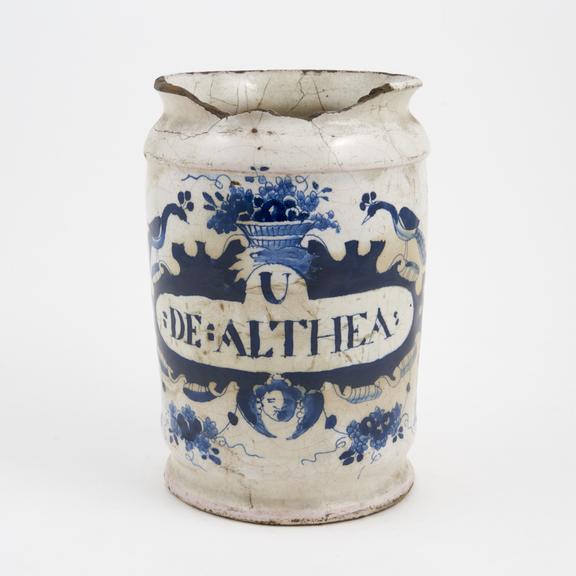 Tin glazed earthenware drug jar, peacock motif