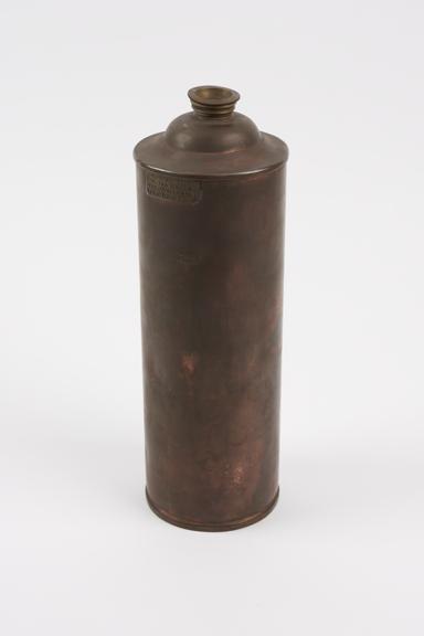 Cylindrical copper hot water bottle with brass filler and screw