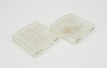 Two Plastic transparent accessory boxes used with Friden Flexowriter