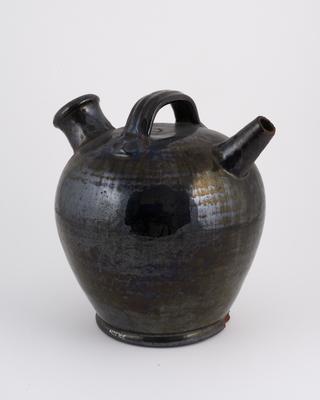 Large black jug with filler and spout (for alchemical purposes)