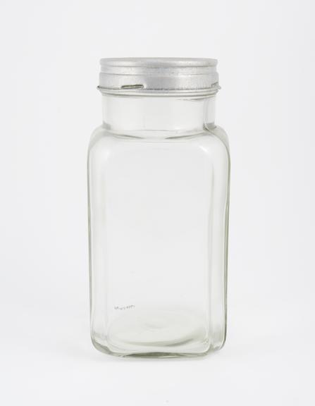 An empty glass jar used to house pathology specimens at