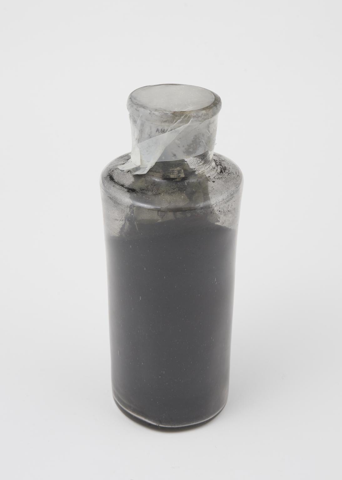Dust Science Glass bottle containing black powder | Science Museum Group Collection