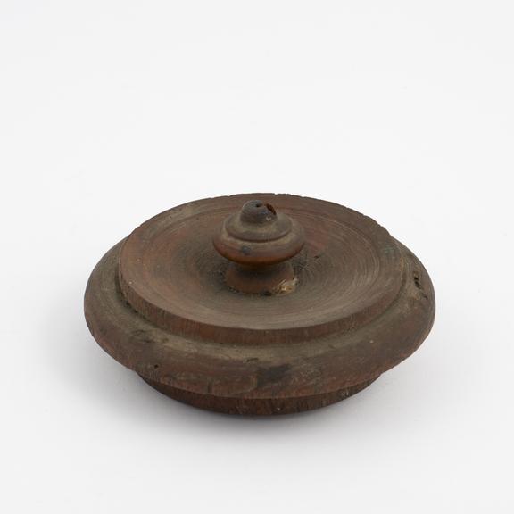 Wooden lid, possibly from a drug jar