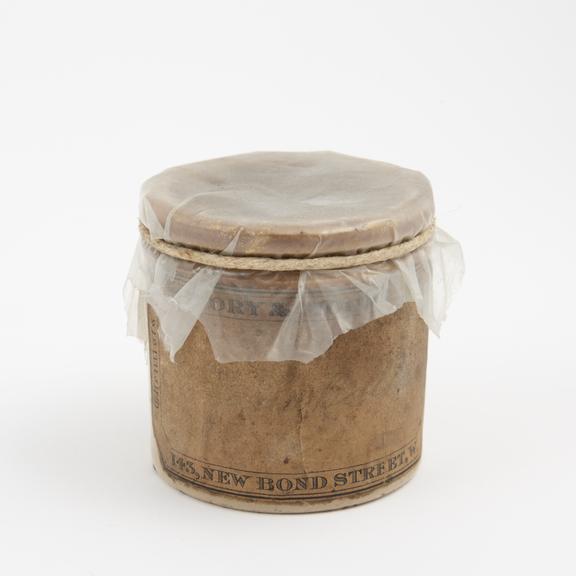 Stoneware ointment jar used for Canada balsam, half full