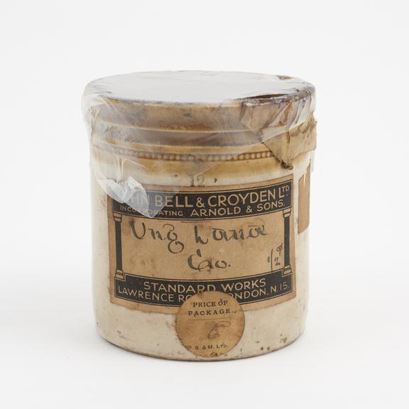 Stoneware drug jar containing ointment