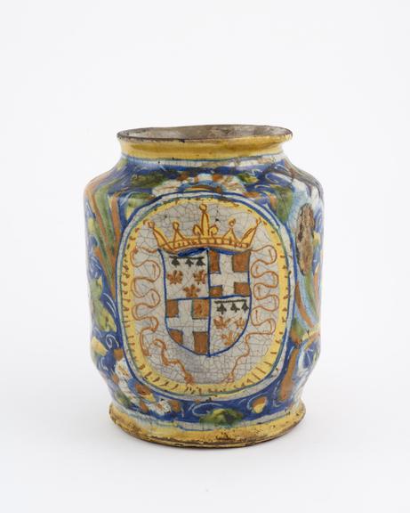 Polychrome tin-glazed earthenware drug jar showing arms of