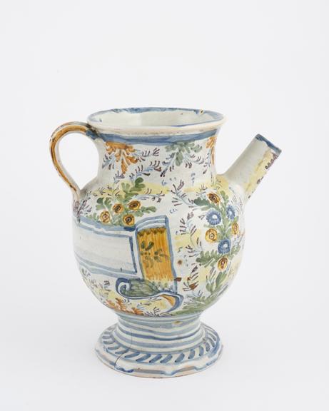 Italian syrup jug, C18 polychrome maiolica with flower and