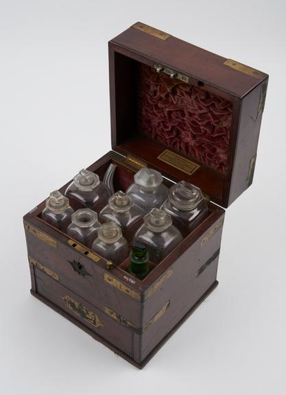 Brass bound mahogany medicine chest, with 9 glass bottles