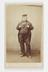 A Carte de visite full-body portrait of a rotund man by E