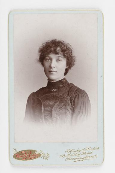 A Carte de visite portrait of a woman with curly hair