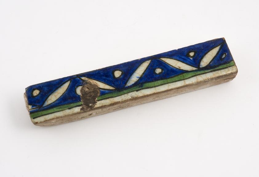 Tin glazed earthenware tile with polychrome decoration