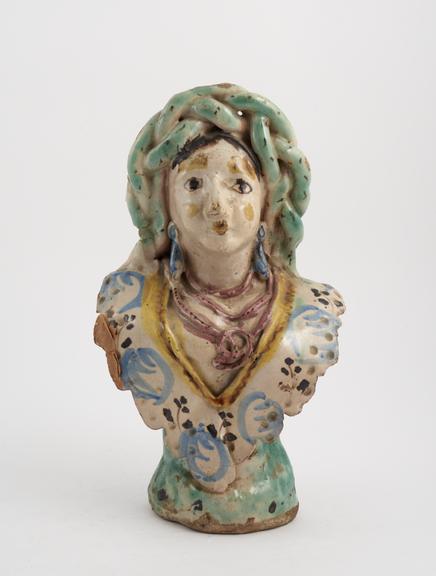 Tin glaze polychrome bottle in the shape of a female bust