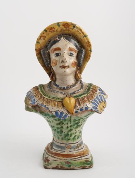 Tin glaze polychrome bottle in the shape of a female bust